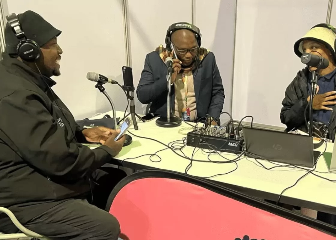Community radio presenters on air in the Village